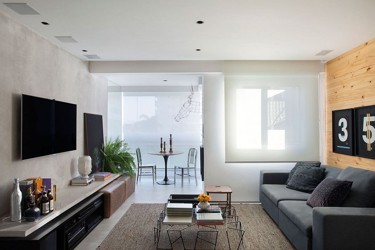 Studio apartment with sheers filtering in natural light.