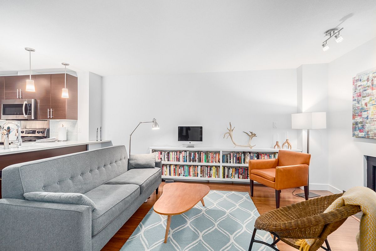 Lovely rug and bookshelf add color to the contemporary interior