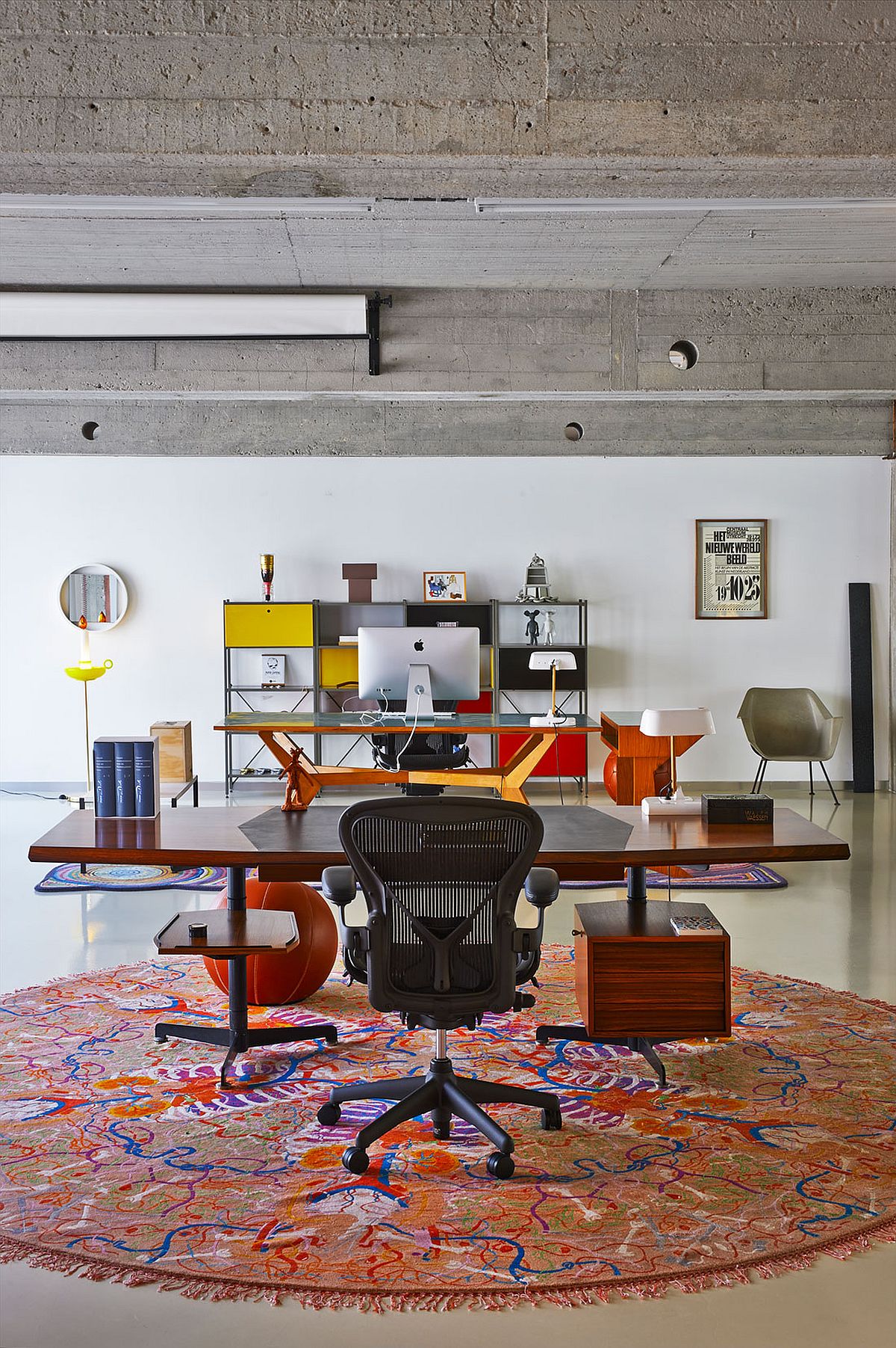Lovely rug defines the workspace in the open area