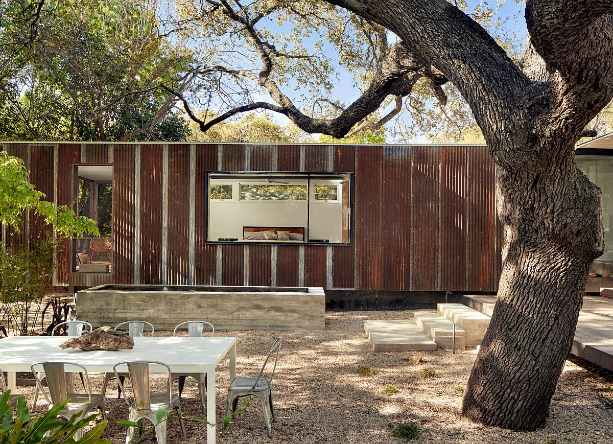 Metallic exterior of the latest extension to a breezy cottage in Austin, Texas