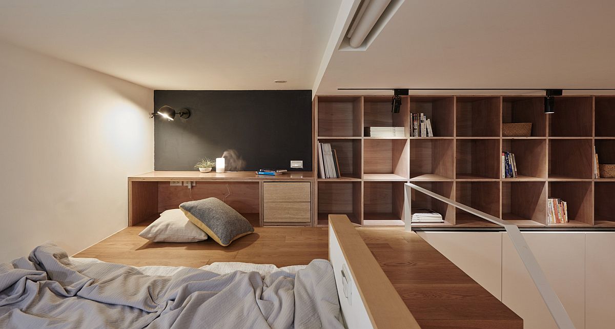 Mezzanine level bedroom and workdesk of the tint Taipei apartment