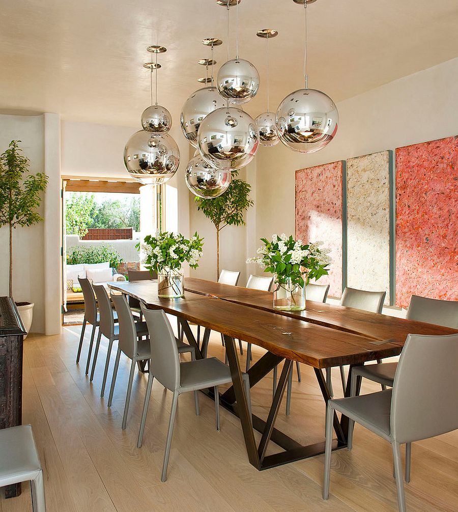 Modern Mediterranean dining room with globe metallic pendants