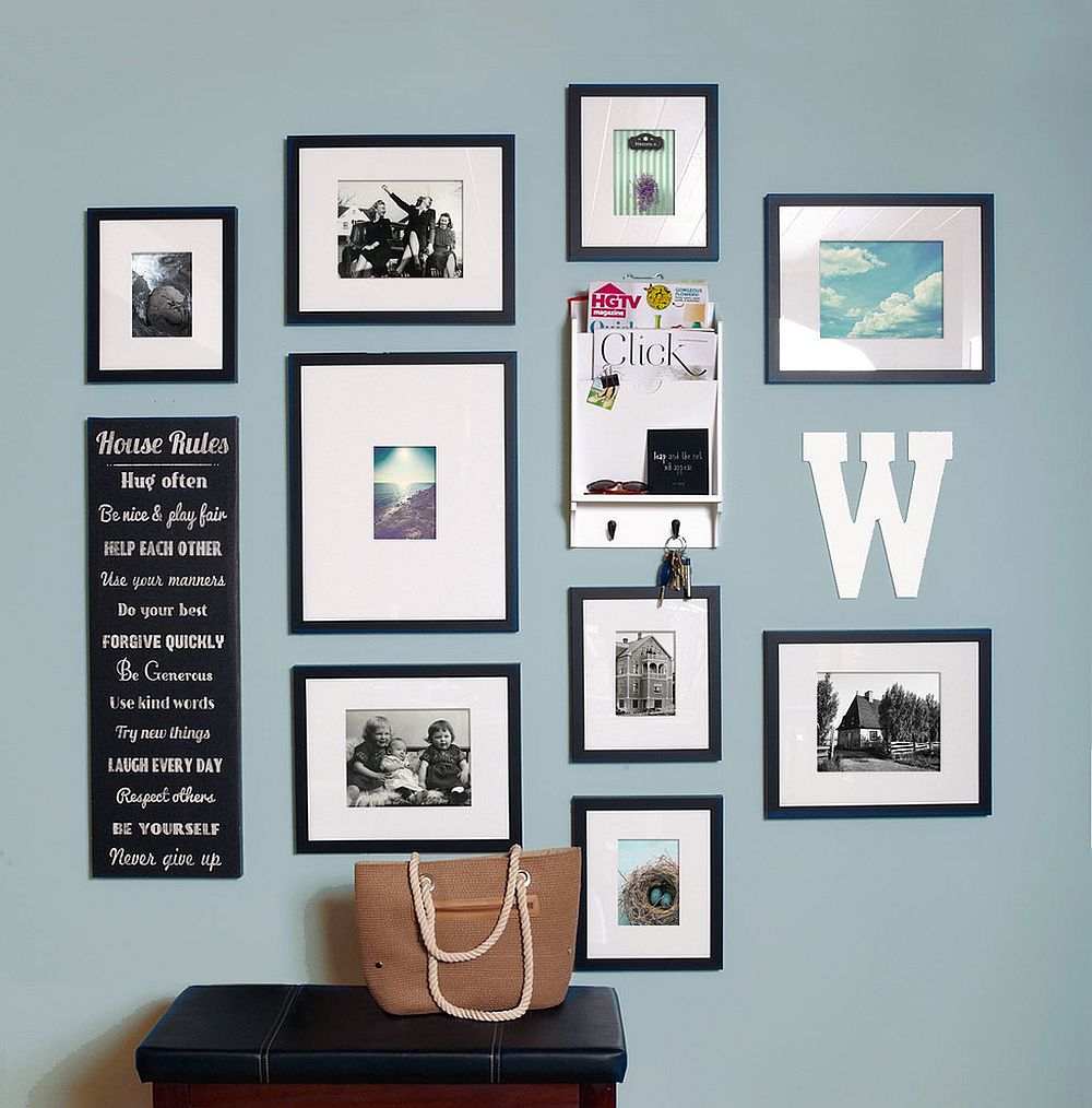 Modern art work coupled with family photographs to create a stylish gallery wall [From: Change of Art]