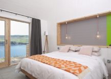 Modern-bedroom-with-nature-views-and-pops-of-orange-and-green-217x155