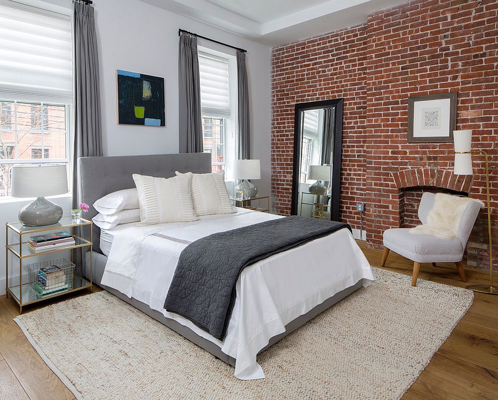 Modern industrial bedroom with nightstands in gold and glass [Design: Décor Aid]