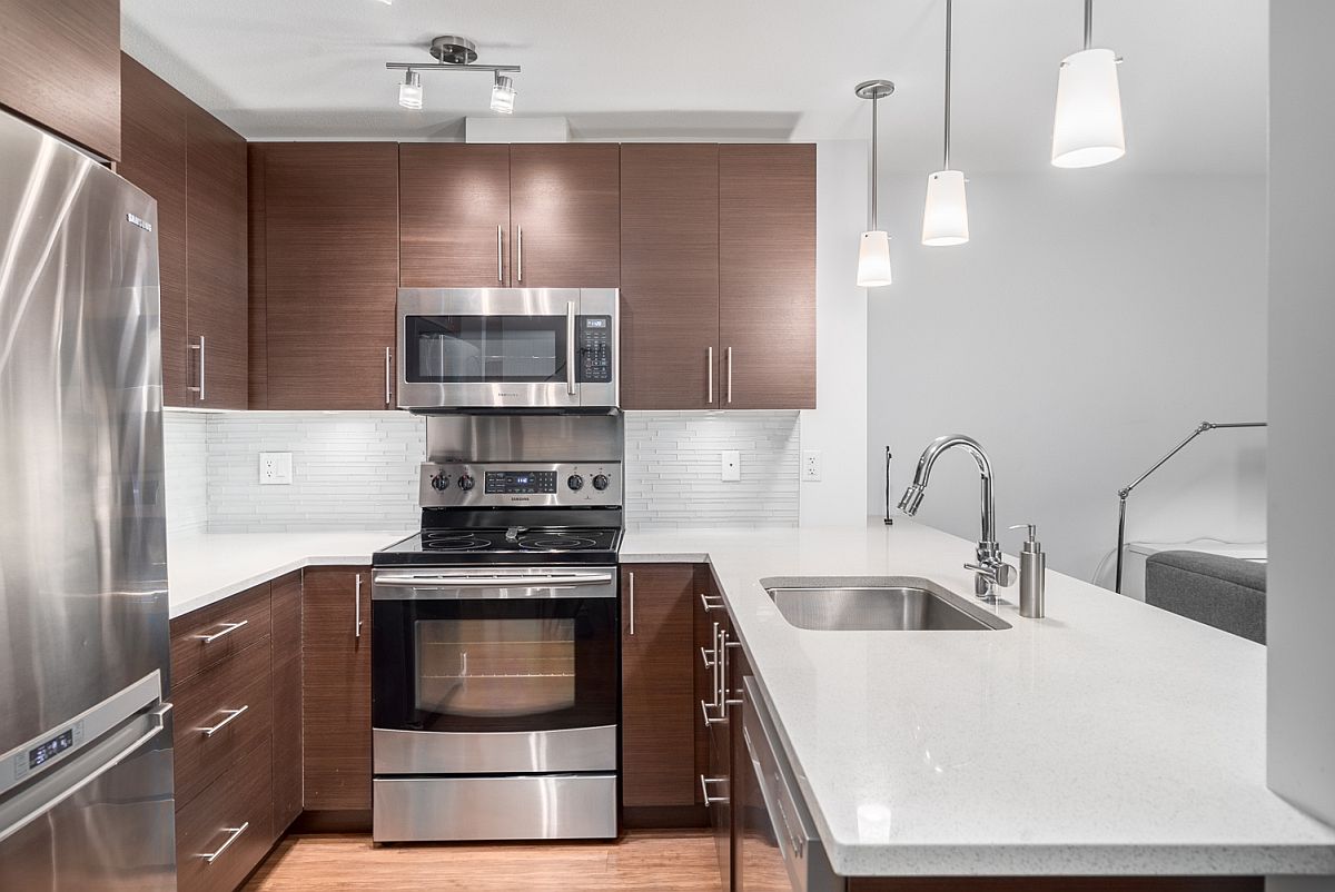 Modern kitchen featuring quartz countertops and stainless steel Samsung appliances