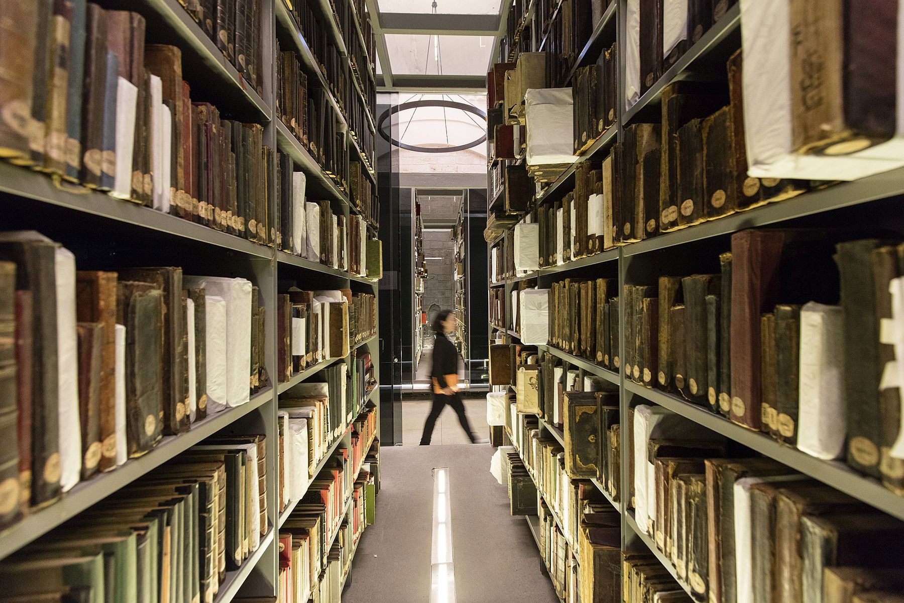 Old manuscripts and books at the Beyazit State Librray housed in minimal, modern glass boxes