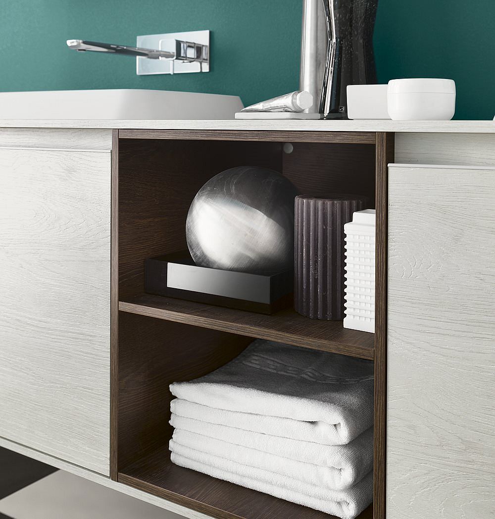 Open shelves combine with closed cabinets that feature handleless doors for the vanity