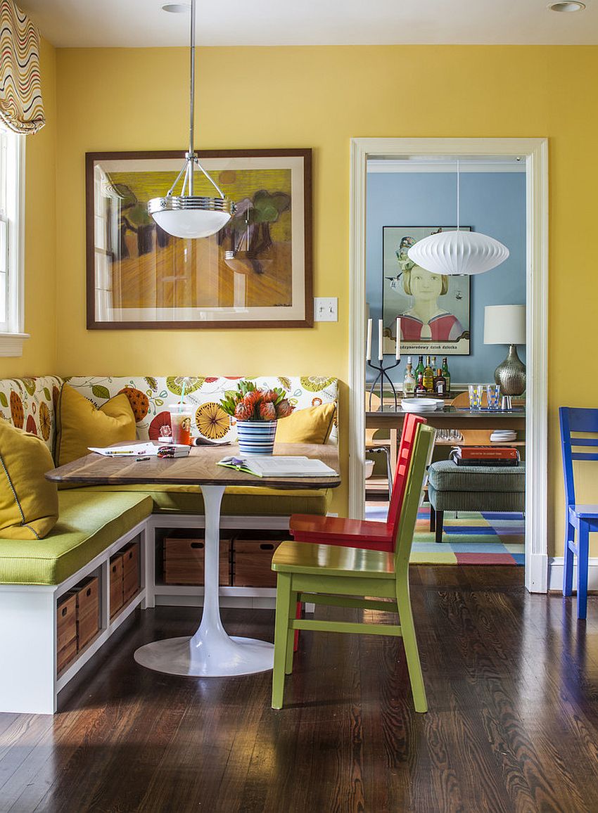 Open storage space under the bright banquette with midcentury décor [Design: Four Brothers / Christopher Patrick]