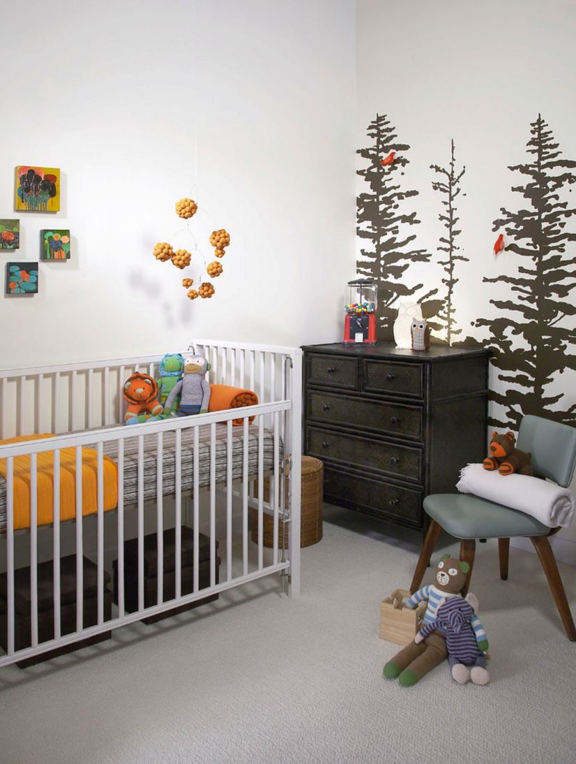 Painted tree mural in an earthy modern nursery