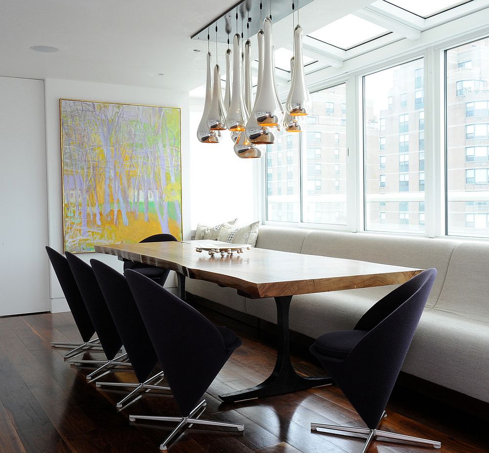 Panton cone chairs and striking metallic pendants coupled with live edge table