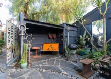Patio-with-garage-or-shed-is-the-perfect-place-to-use-the-road-sign-217x155