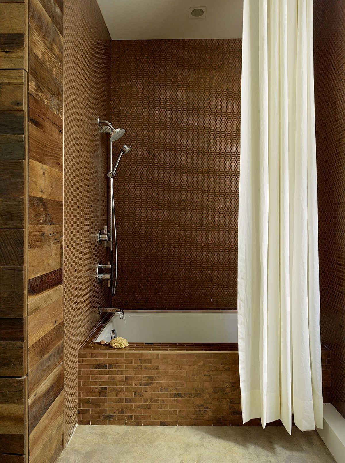 Penny tiles create glittering walls in the shower area