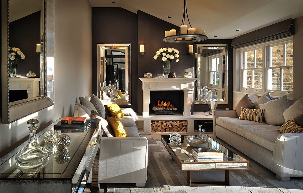 Posh living room of London penthouse with cozy fireplace and mirrored décor [Design: Zephyr Interiors]