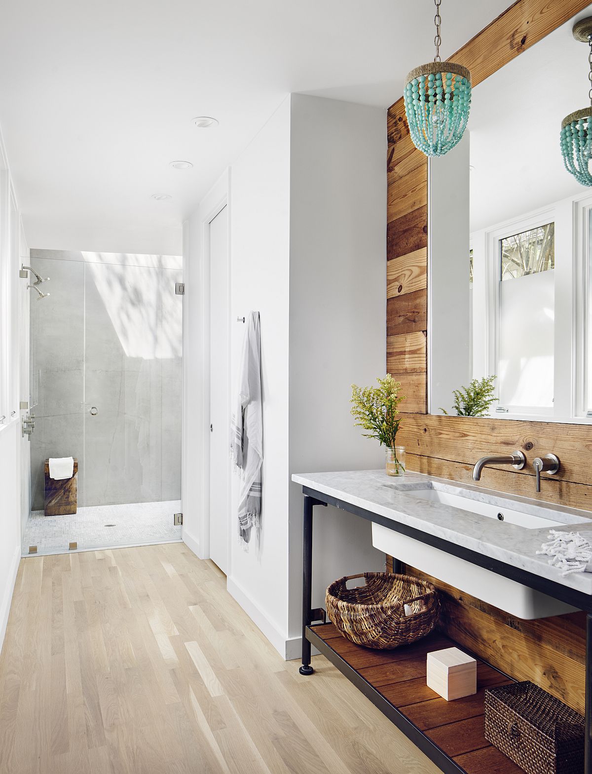 Reclaimed wood adds softness and unique character to the contemporary white bathroom