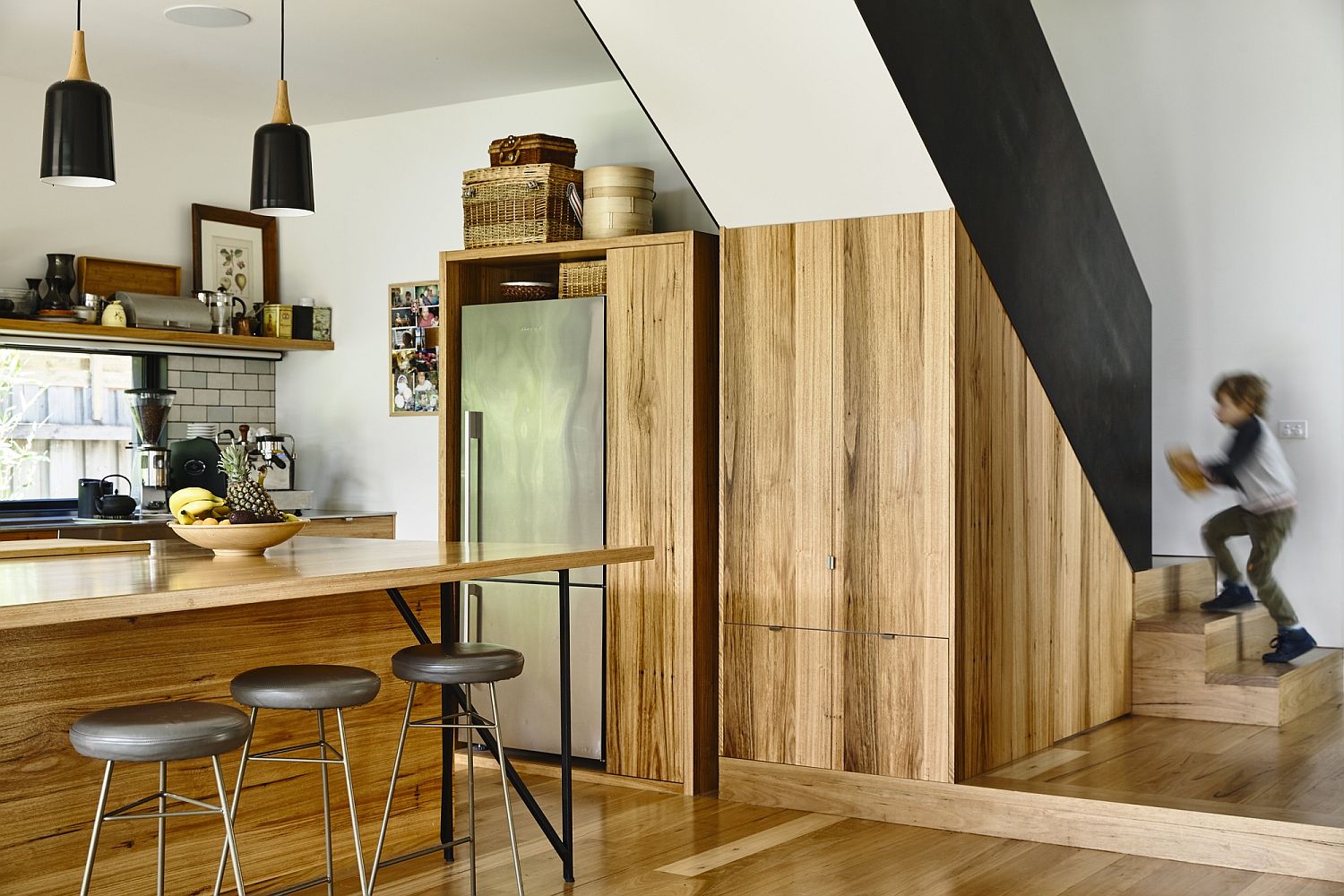 Revamped kitchen design with a fabulous wooden island and tiled backsplash