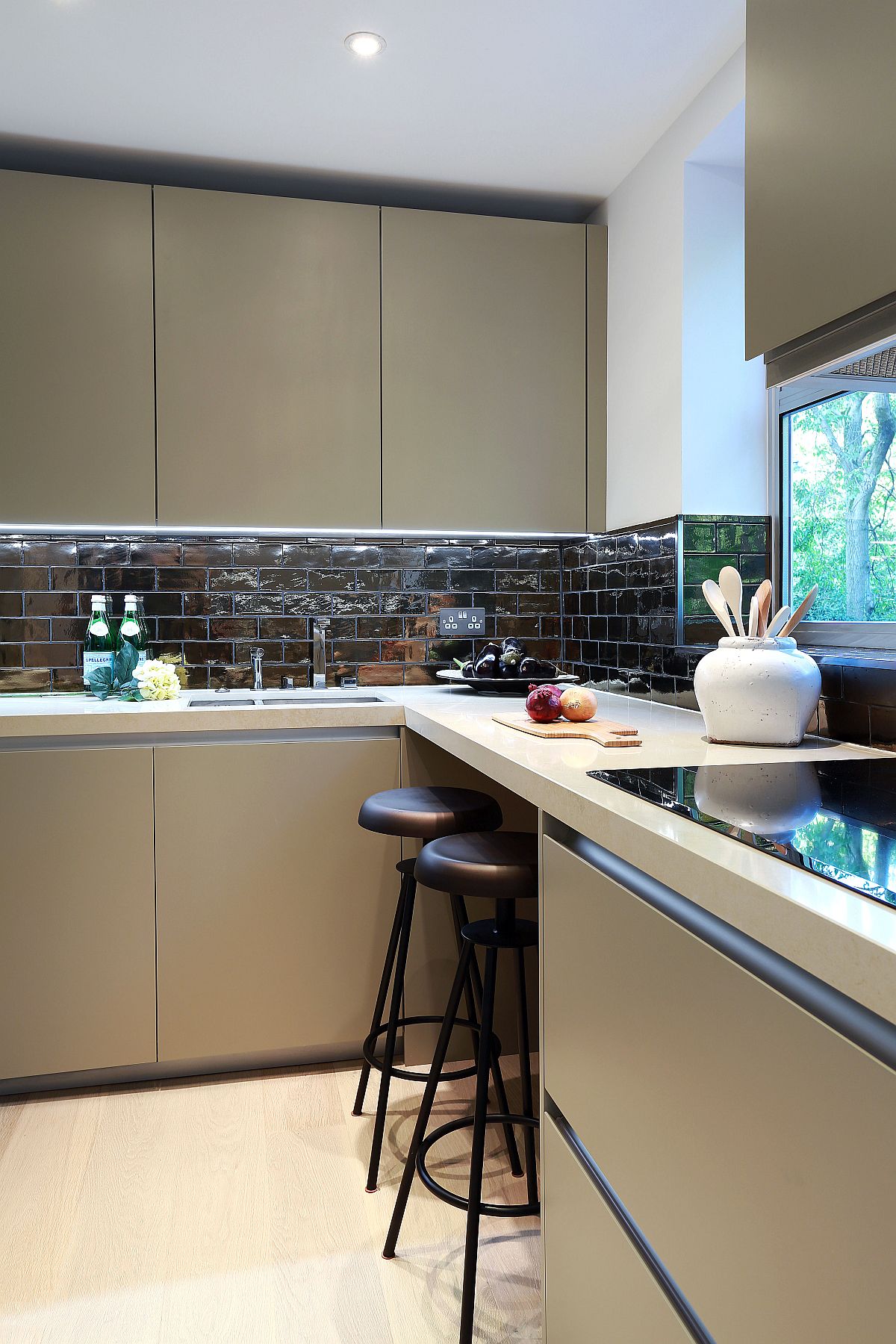 Revamped kitchen space on the second level with a glittering backsplash