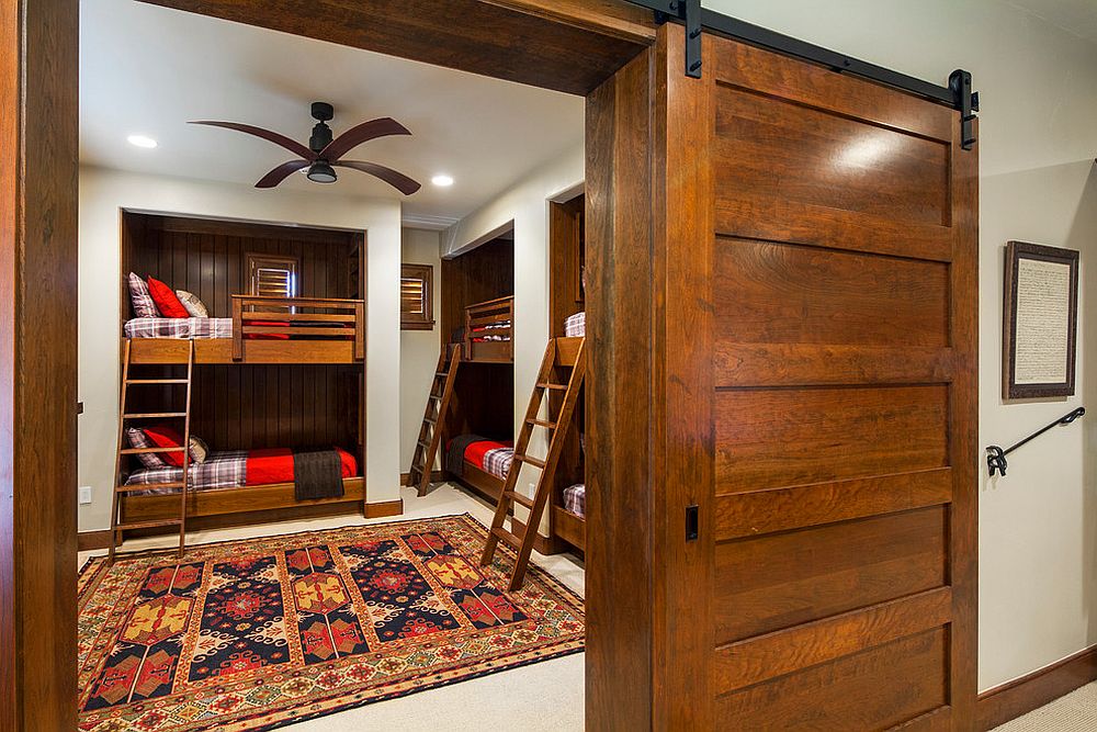 Rustic kids' bedroom with bunk beds and a smart sliding door