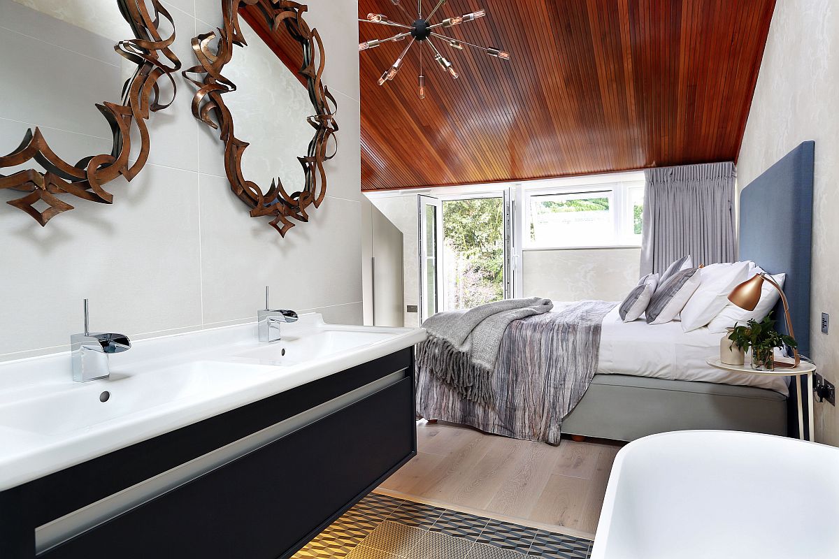 Sensational bronze mirrors above the vanity steal the show in this master bath