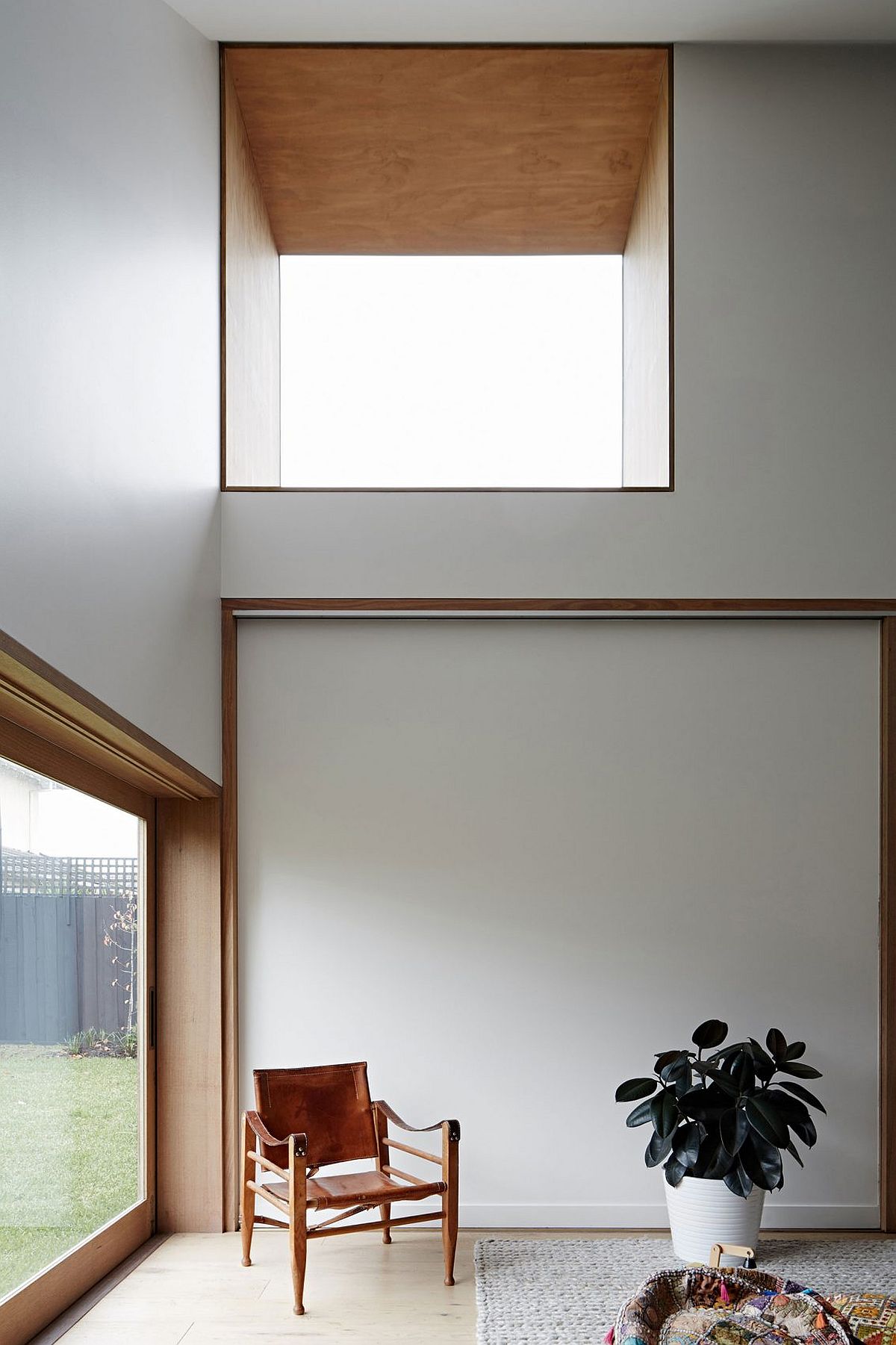 Sliding doors and high windows bring in ample natural light