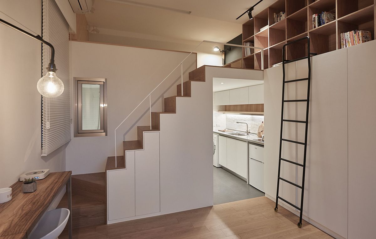 Small apartment makes complete use of vertical space on offer with floor-to-ceiling shelves