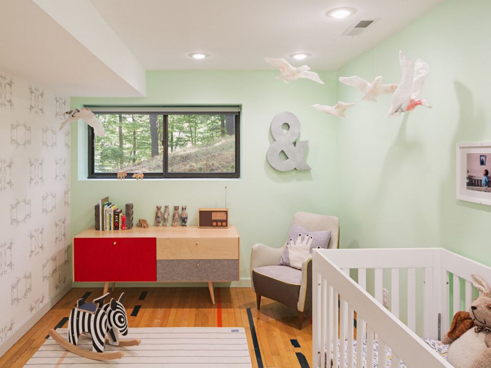 Subtle wallpaper in a mint nursery