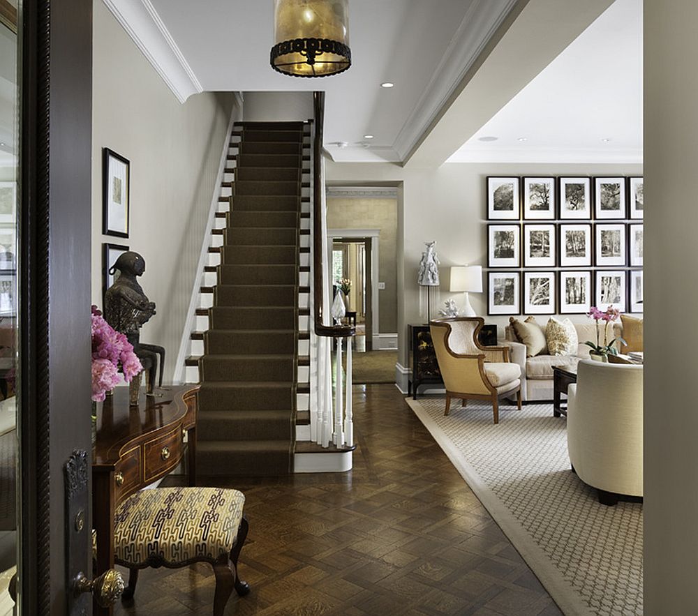 Traditional entry shares a gallery wall with the living room [Design: Rugo/ Raff Ltd. Architects]