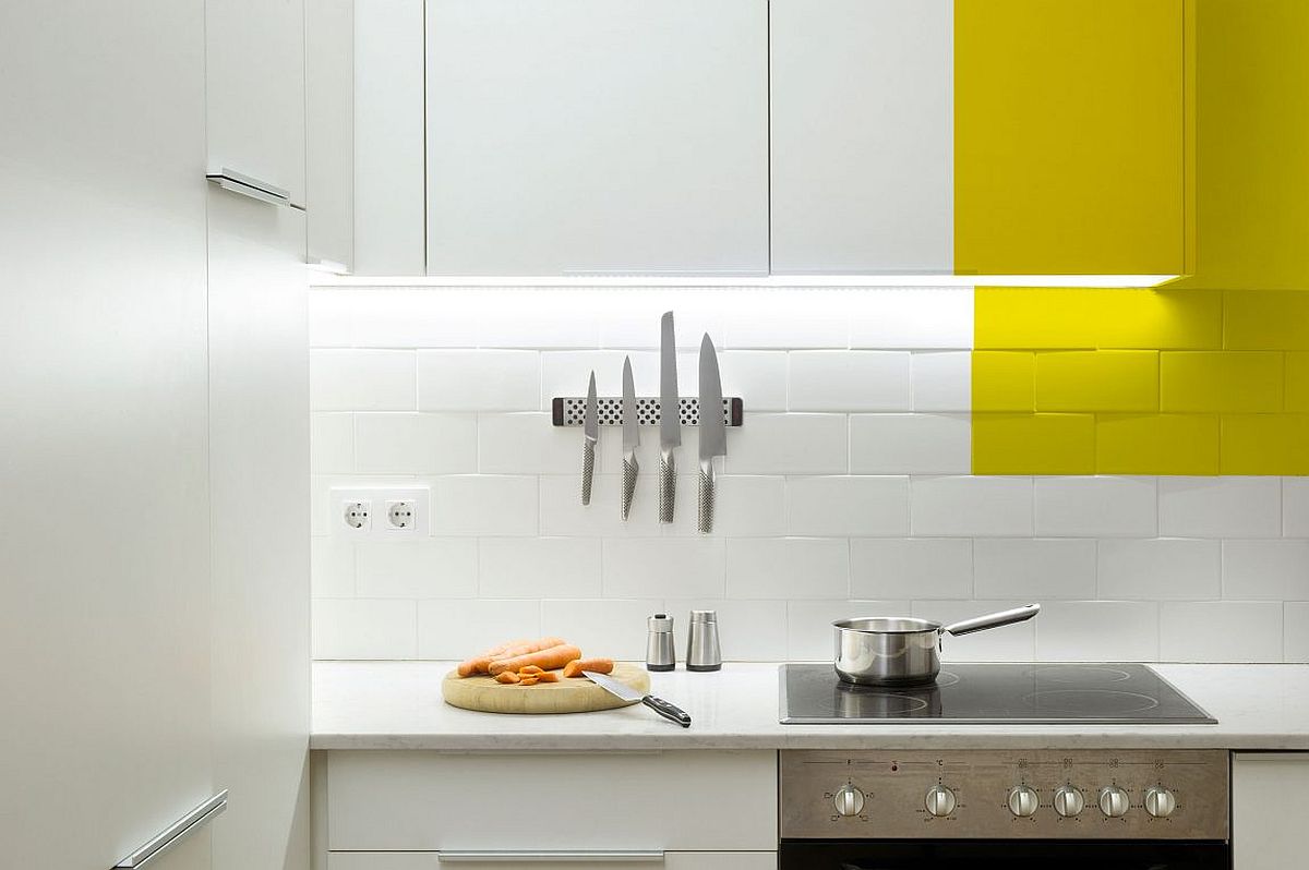 Under cabinet LED strip lightinga nd tiled backdrop for the small kitchen in white