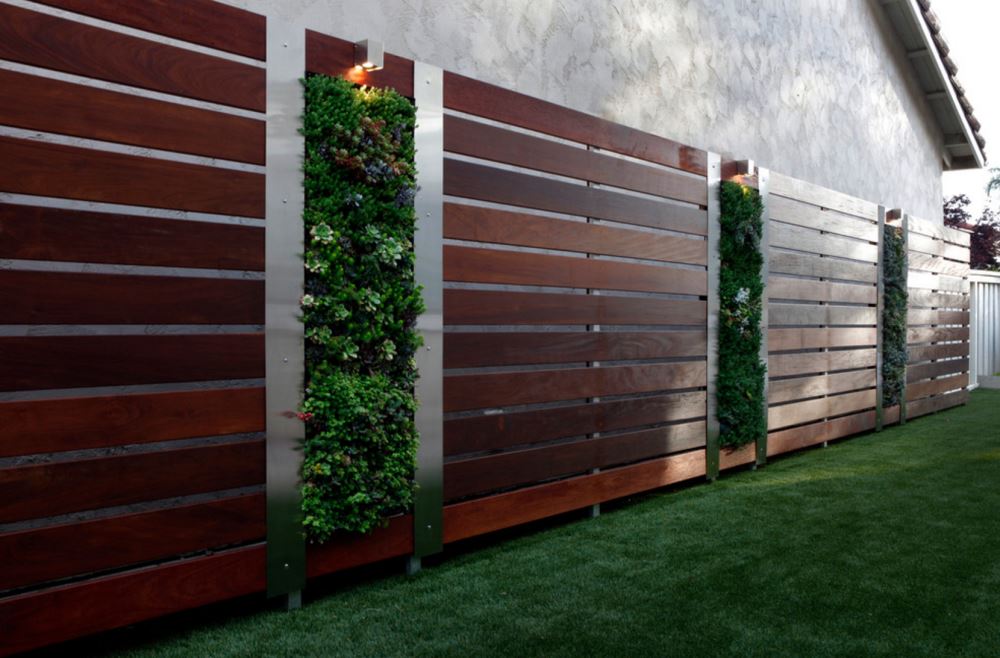 Vertical gardens in a modern fence