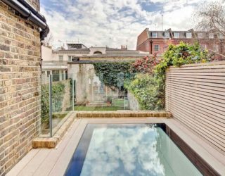 Nifty Extension with Walk-On Skylights Enlivens This Terrace House