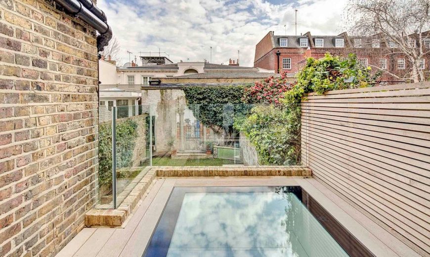 Nifty Extension with Walk-On Skylights Enlivens This Terrace House