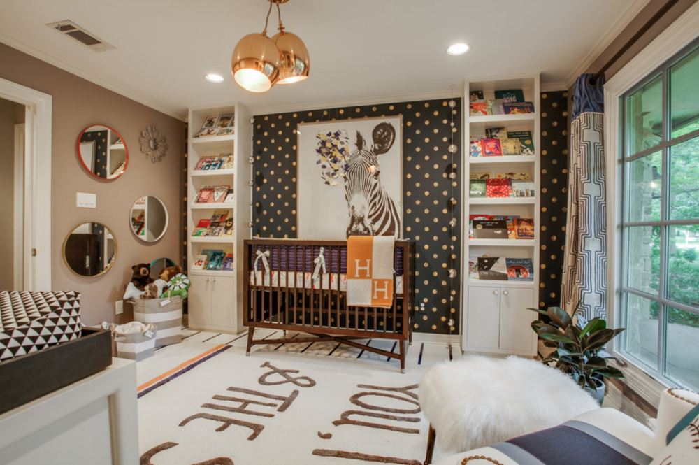 Wallpaper and wall art in a beautifully appointed nursery