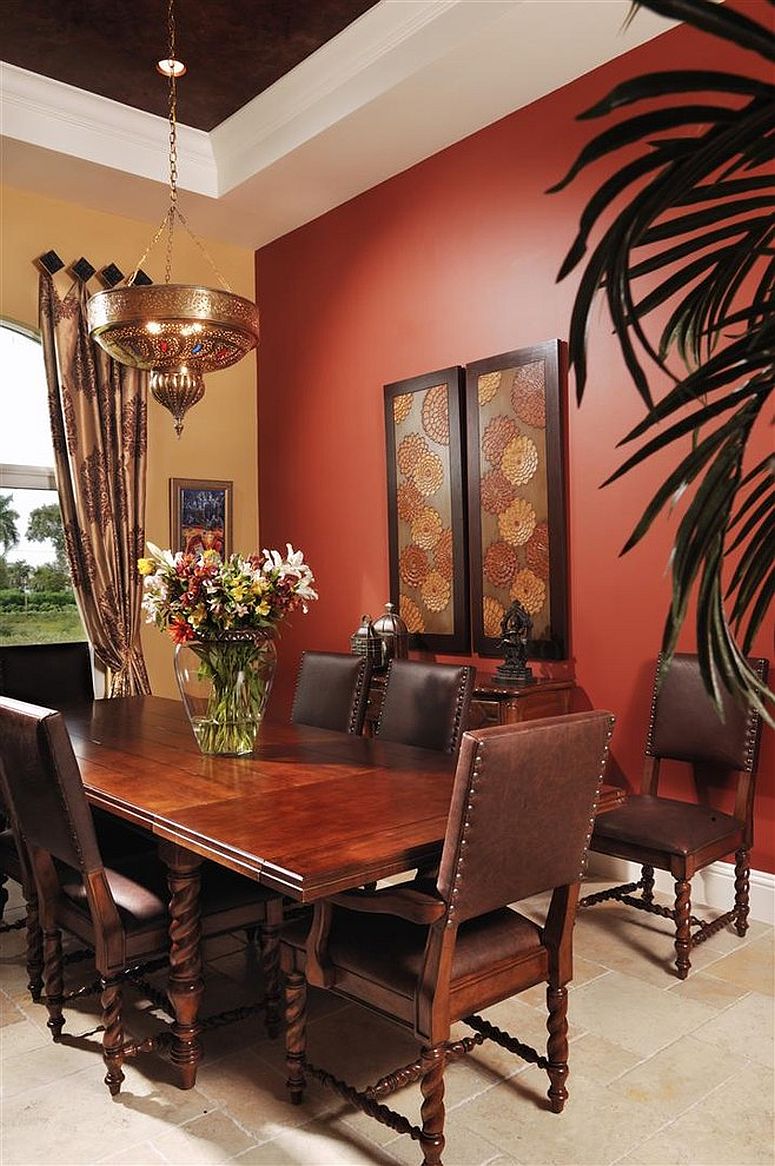 Warm yellow and bright red create a bold backdrop for this Moroccan dining room [From: Interiors by Myriam]