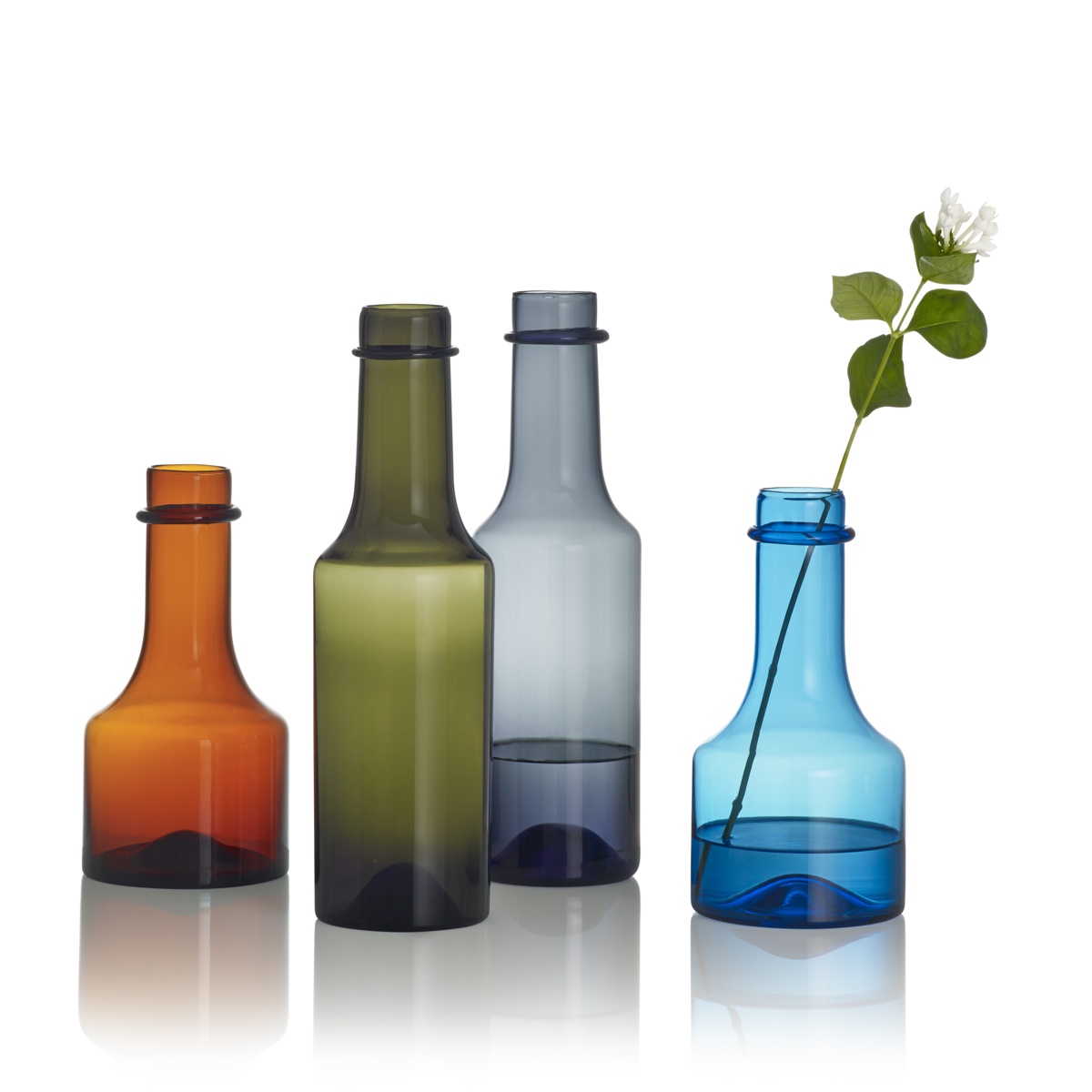 Wirkkala glass bottles. Designed by Tapio Wirkkala and originally produced by Iittala between 1959 and 1968. Image © Fiskars Finland.