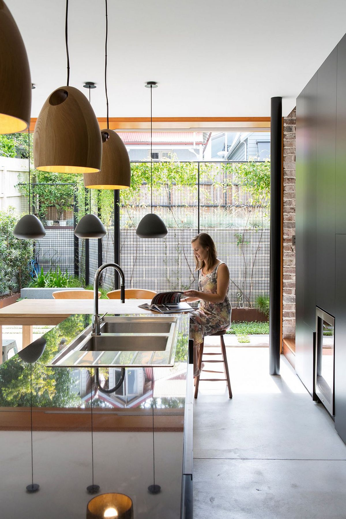 Wonderful use of wooden and metallic pendants brings in contrast and style