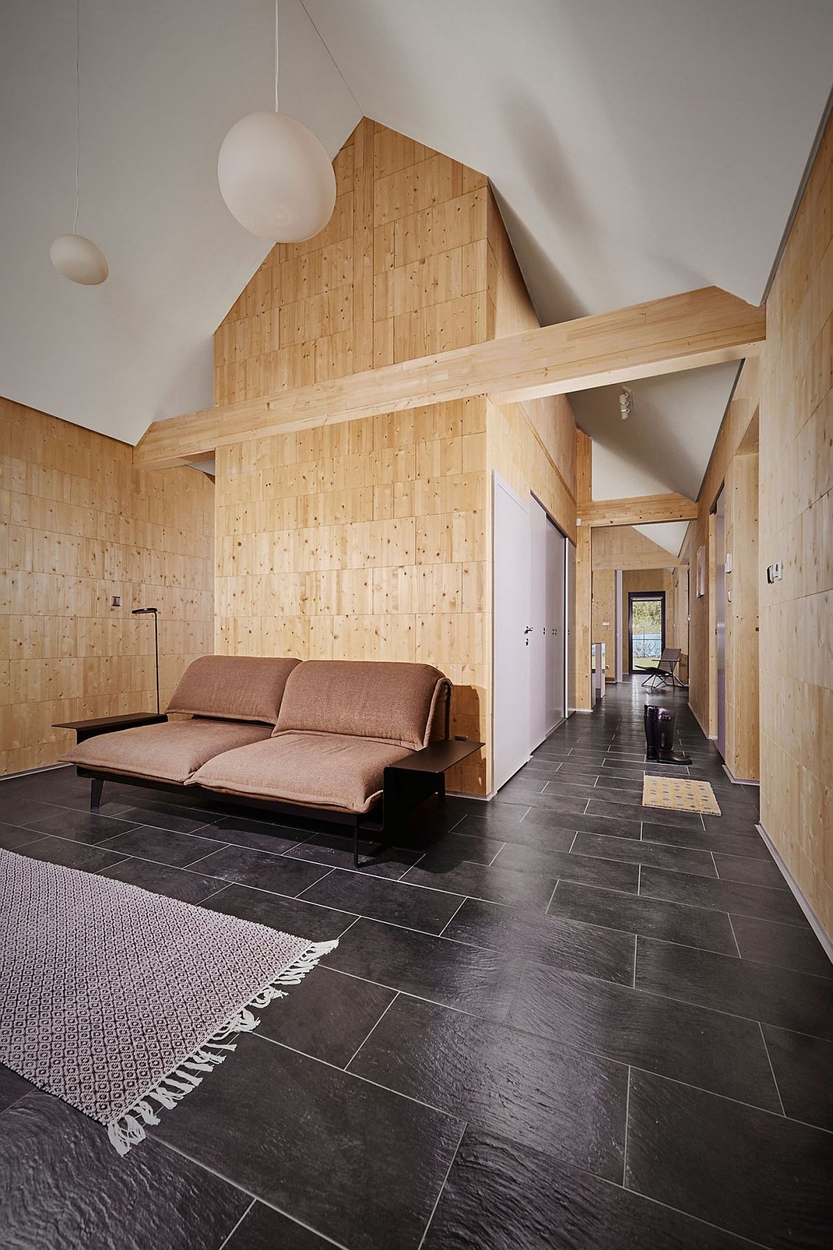 Wooden bricks and minimal style shape the interior of the house