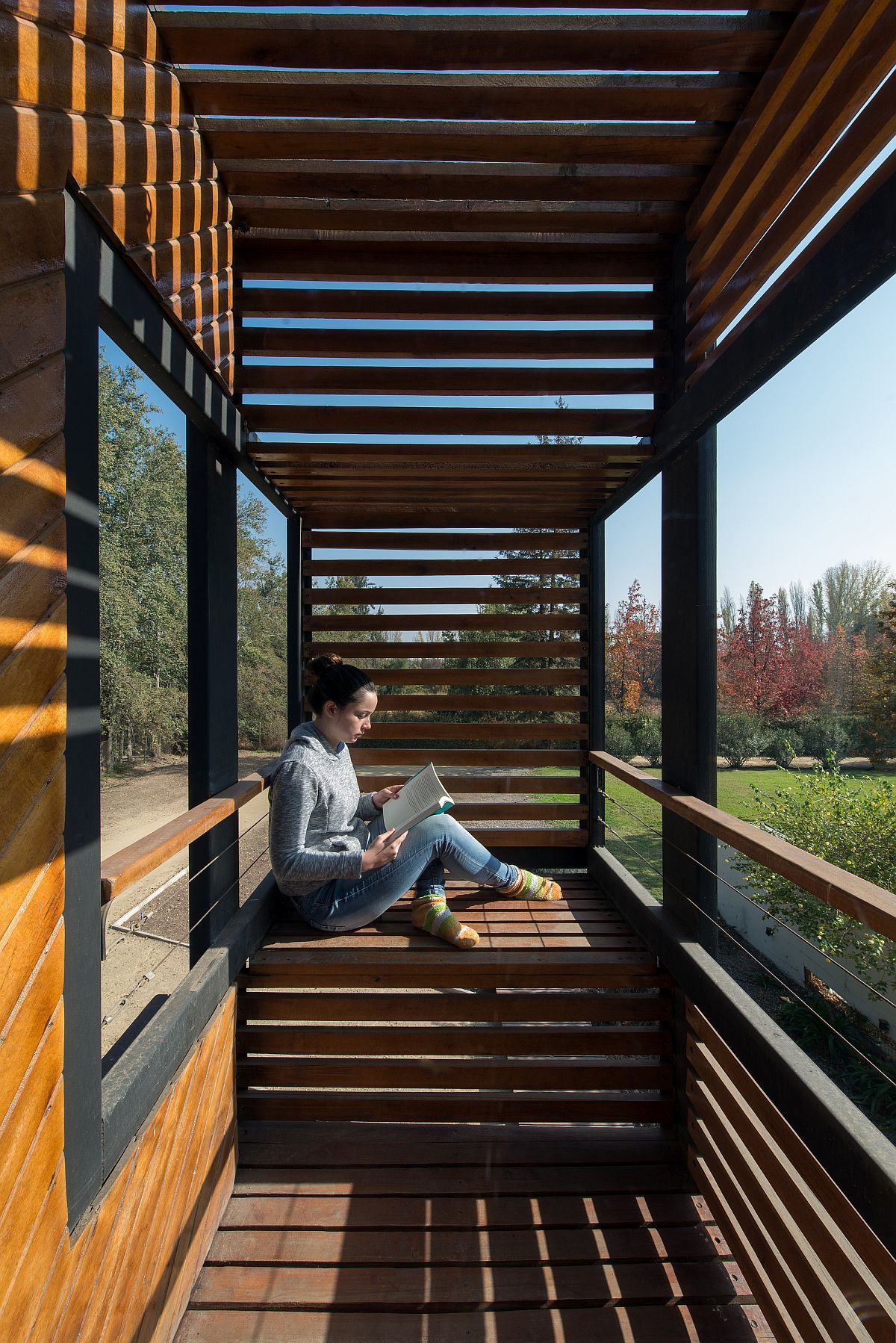 Wooden slat offer the perfect shelter from sunlight even as the home offers stunning views of the lovely landscape