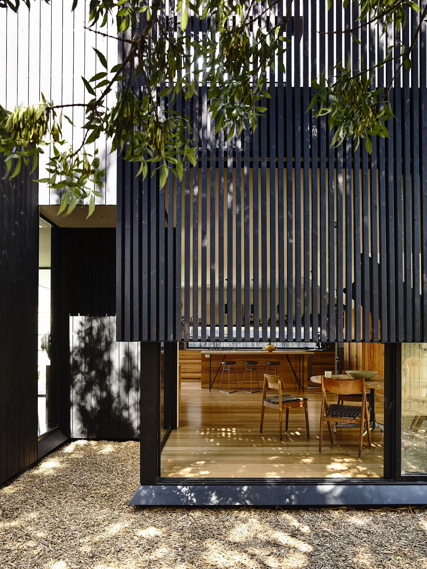 Wooden slats filter in sunlight and give the homeonwers adequate privacy
