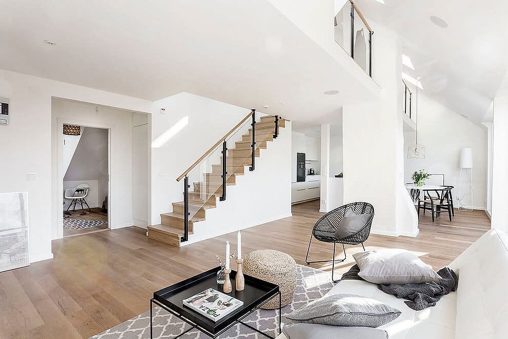 Wooden staircase with glass railing for the modern Scandinavian home