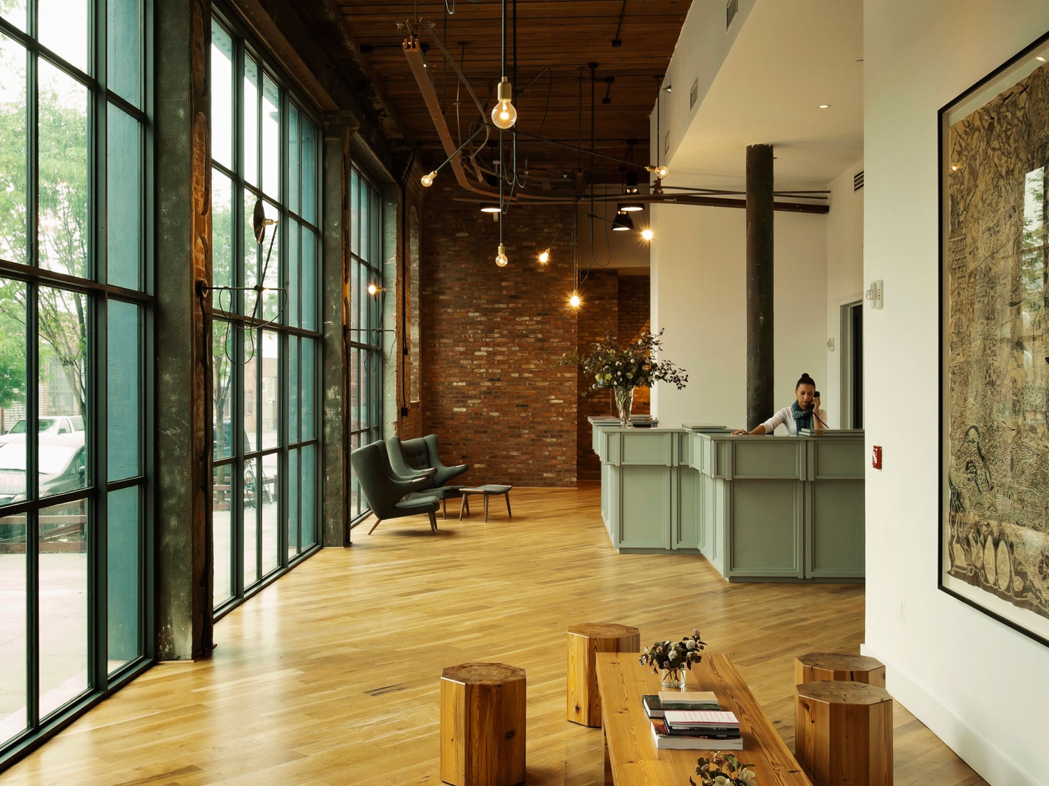 The Wythe Hotel in Brooklyn's hip Williamsburg neighbourhood synthesises a number of smart industrial characteristics, from exposed brick to brilliant lighting and grey steel.