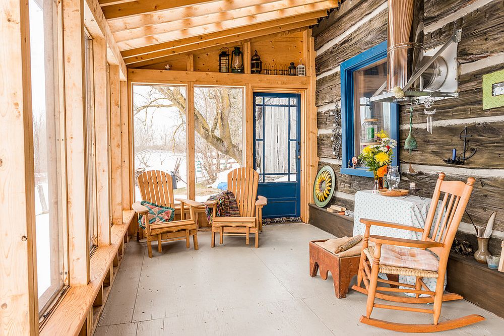 A dash of blue enlivens the cool and modest rustic sunroom draped in wood [Design: Bespoke Carpentry & Joinery]