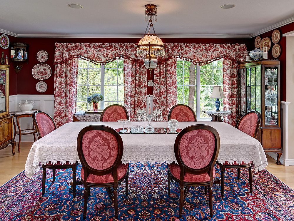 Antique rug, floral drapes and beautiful red walls bring the Victorian dining room alive [Design: Ravnik & Co]