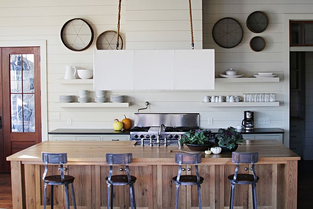 Beach style kitchen with kitchen island draped in reclaimed timber planks