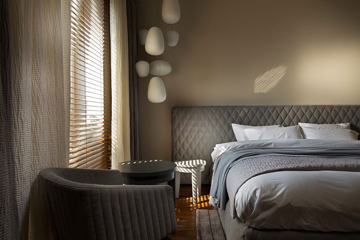 Bedside lighting saves space even as it adds to the feminine vibe of the room