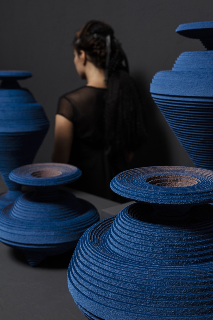 "Blue Alchemy" vases are made by hand from coiled coloured felt strips.