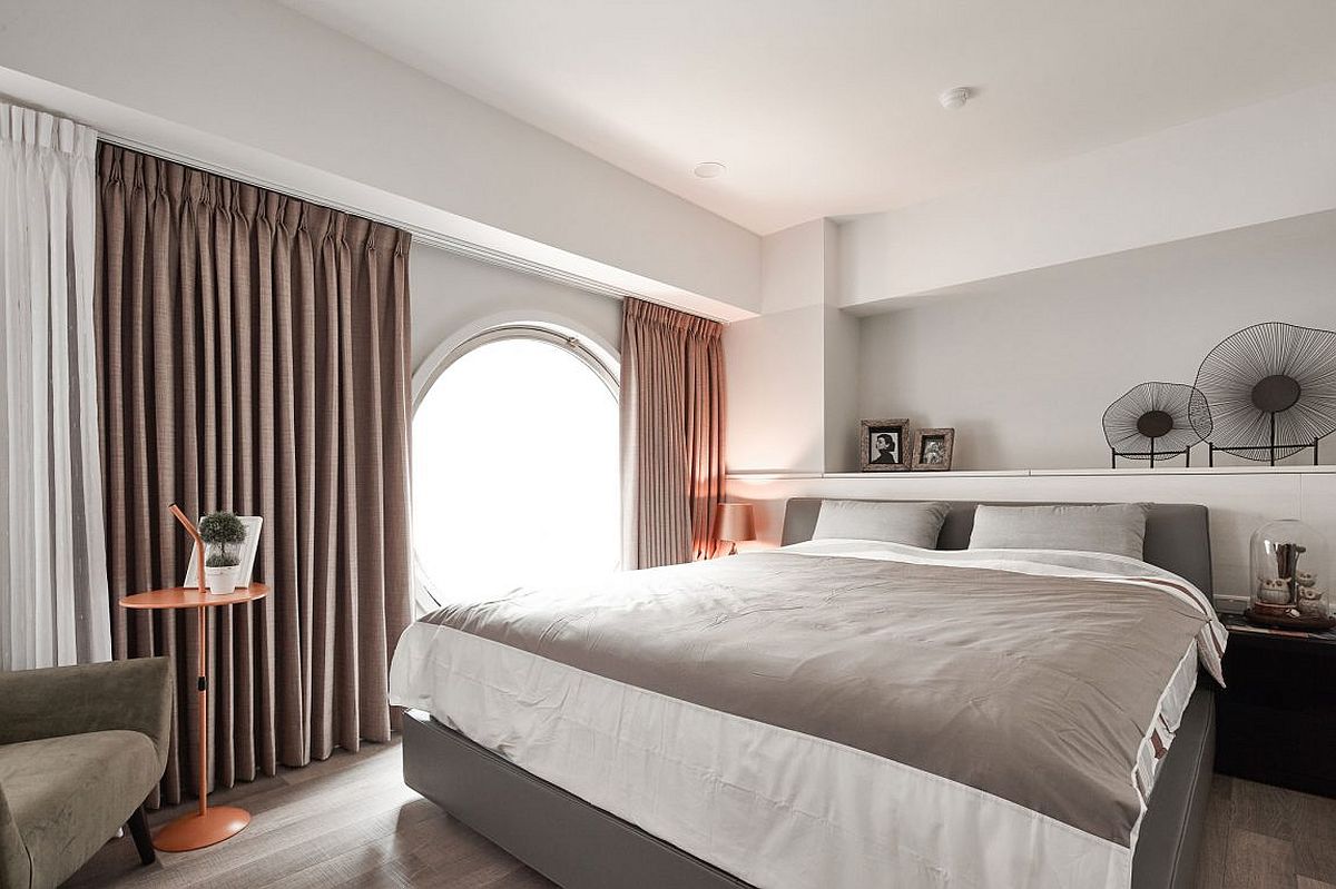Circular window in the bedroom is a showstopper