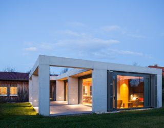 Glass and Concrete Pavilion Extends Timber-Paneled Home in Leipzig