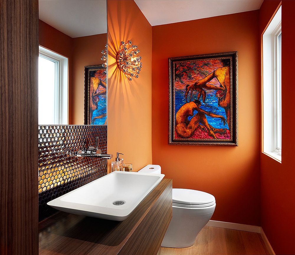 Contemporary powder room in bright orange with dazzling backsplash for sink