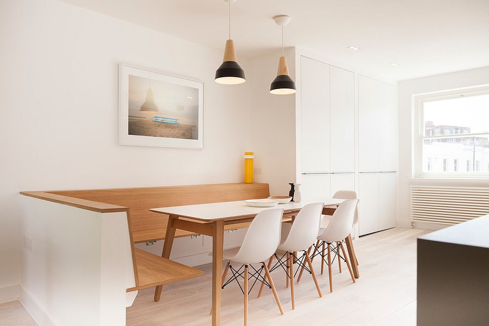 Cozy and minimal kitchen banquette epitomizes the simplicity of Scandinavian style [Design: Tom Lousada / Photography: Amandine Alessandra]