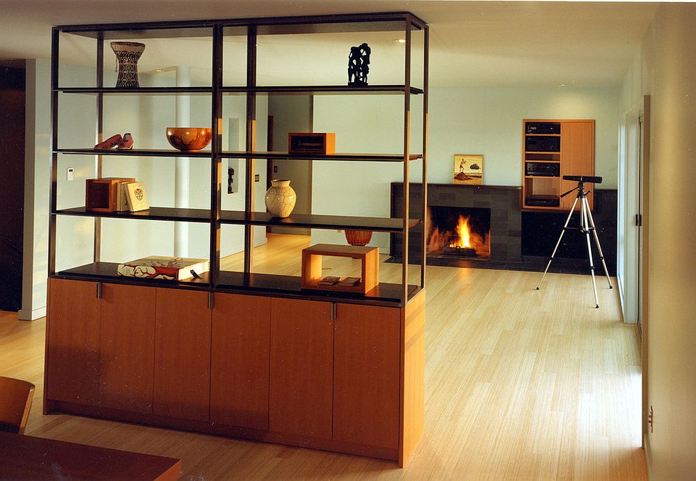 Cupboard and bookshelf unit offers storage and display space even while doubling as a room divider